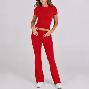 Two-piece red set featuring a slim-fit short-sleeved T-shirt and flared high-waisted pants