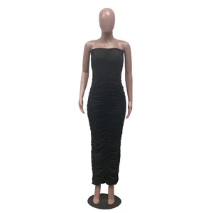Macro view showing the elegant ruched texture of this black strapless bodycon maxi dress.