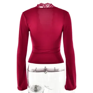 Back view of wine red long-sleeved top with delicate lace trim collar