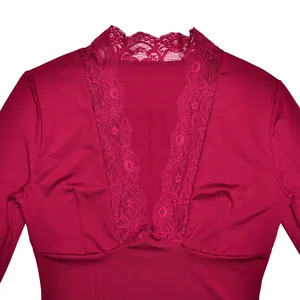 Detail view of burgundy long sleeve top with sexy V-neck and delicate floral lace trim