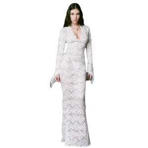 Elegant white lace maxi dress featuring a deep V-neck and stylish flared sleeves for summer.