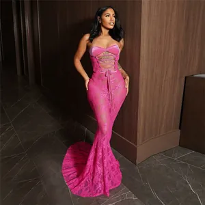 Elegant hot pink lace mermaid dress with lace-up cutout detail and sheer mesh fabric