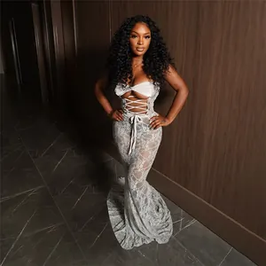 Detailed view of an elegant white lace-up hollow design mesh sheer tube maxi dress
