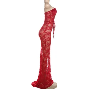 Detailed side profile of sheer red lace fabric and elegant floor-length silhouette