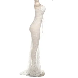 Side view detail of an elegant white lace strapless maxi dress with tie-up design