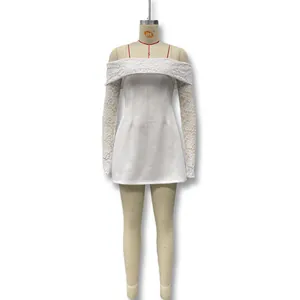 Detailed view of an elegant white off-shoulder lace mini dress displayed on a mannequin
