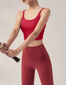 Close-up detail view of vibrant red quick-dry sports bra and high-waist leggings set