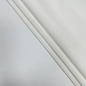 Detailed macro view showing the intricate texture of elegant white jacquard lace fabric