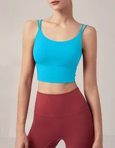 Detailed view of a bright blue cross-back sports bra with thin double straps