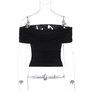 Detailed view of black off-the-shoulder ruched crop top on a transparent mannequin.