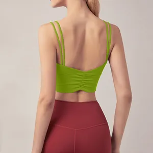 Detail view showing the sexy ruched back and double thin straps of this lime green sports top