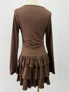 Back view of brown slim-fit long-sleeved dress with multi-layer ruffled hem
