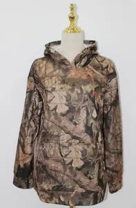 Detailed view of women's oversized camouflage hoodie with maple leaf print and pocket