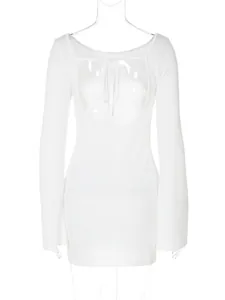 Detailed macro view of white backless dress featuring elegant lace-up design and flare sleeves