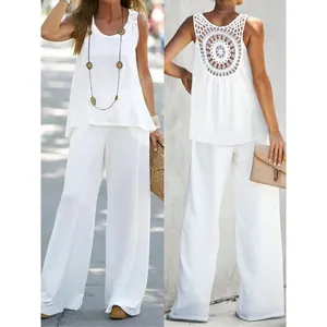Detailed view of white sleeveless top and wide-leg pants set with crochet back
