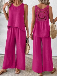 Detailed view of women's fuchsia two-piece set featuring intricate crochet back design