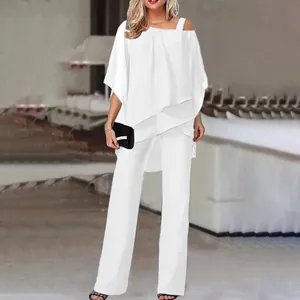 Full-body view of elegant white two-piece set featuring asymmetrical top