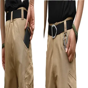 Detail shot of khaki tactical cargo shorts showing multi-pocket and gear attachment features.