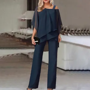 Elegant navy blue two-piece set featuring off-shoulder batwing top and wide-leg trousers