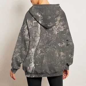 Back view of an oversized women's hoodie featuring detailed grey maple leaf camo print