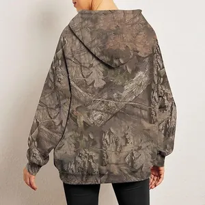 Back view of women's oversized camouflage hoodie featuring realistic maple leaf print