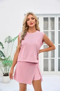 Detail view of women's pink casual two-piece set with sleeveless top and wrap skirt