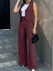 Detail view of wine red two-piece suit with vest and wide-leg pants for women