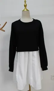 Faux two-piece sweatshirt dress featuring black long sleeves and white pleated skirt