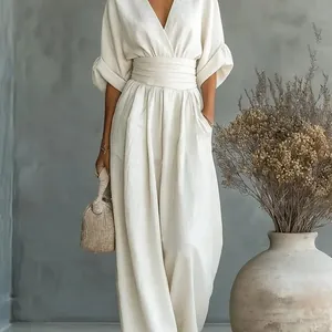 Elegant V-neck high-waist jumpsuit in cream white featuring stylish wide-leg trousers.