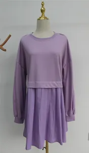 Full view detail of a purple long-sleeved sweatshirt dress with pleated skirt design