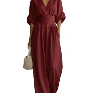 Elegant maroon V-neck jumpsuit featuring cinched waist and wide leg design for women
