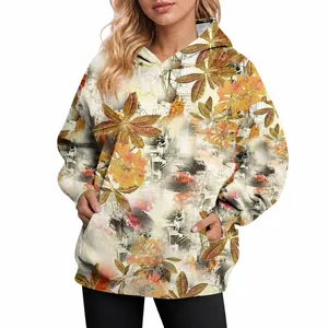 Detailed view of women's oversized autumn hoodie featuring a vibrant maple leaf print