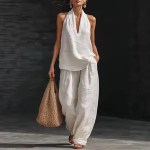 Chic women's white sleeveless halter top and wide-leg pants two-piece summer outfit
