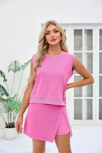 Detailed close-up of a pink sleeveless casual top and matching wrap skort set for summer.