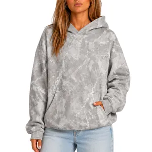 Close-up detail of women's oversized grey marble print hoodie with a front kangaroo pocket
