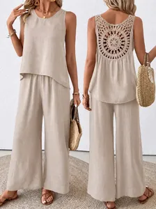 Beige two-piece linen set featuring sleeveless top and back crochet detail trousers