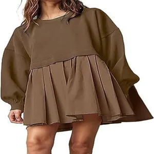 Detailed shot of a brown oversized long-sleeve sweatshirt pleated dress