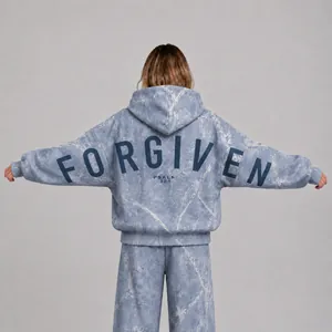 Detailed back view of women's light blue marble print oversized hoodie with Forgiven text
