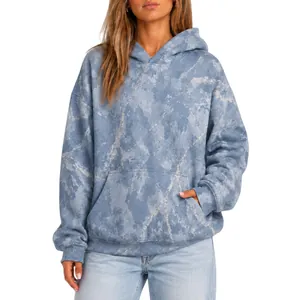 Close-up detail of women's oversized marble print long sleeve hoodie with kangaroo pocket
