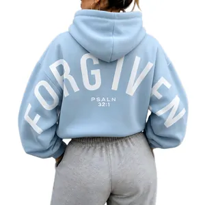 Detailed back view of oversized light blue hoodie featuring white Forgiven Psalm print