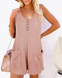Casual mauve waffle knit sleeveless romper with functional buttons and front pockets