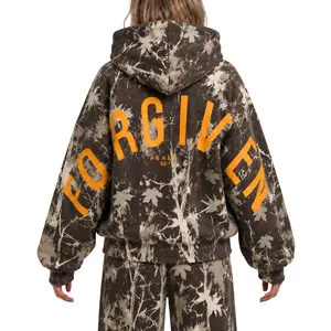 Back view of women's oversized camouflage hoodie with orange 'FORGIVEN' text print
