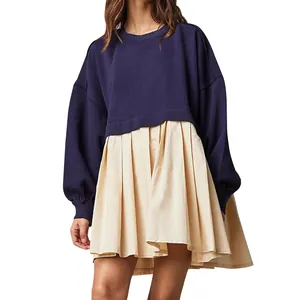 Navy blue oversized sweatshirt layered over a beige pleated skirt dress for women