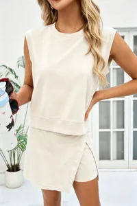 Close-up of sleeveless cream cotton loungewear set with wrap-style shorts for women