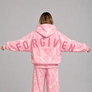 Detailed back view of pink marble print hoodie featuring 'FORGIVEN' text print.