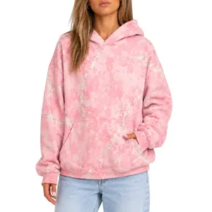Detail view of pink marble pattern on women's oversized long-sleeved hooded sweatshirt.