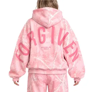 Back view of pink camouflage oversized hooded sweatshirt with Forgiven text print
