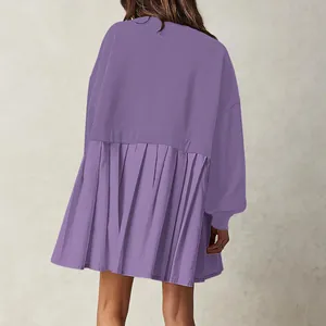 Back view of a purple oversized sweatshirt dress with stylish pleated hem detail.