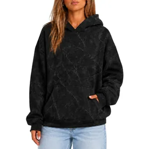 Detailed front view of a black oversized hoodie with subtle marble print texture