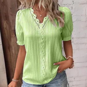 Summer green women's blouse with elegant lace V-neck and pleated puff sleeves detail